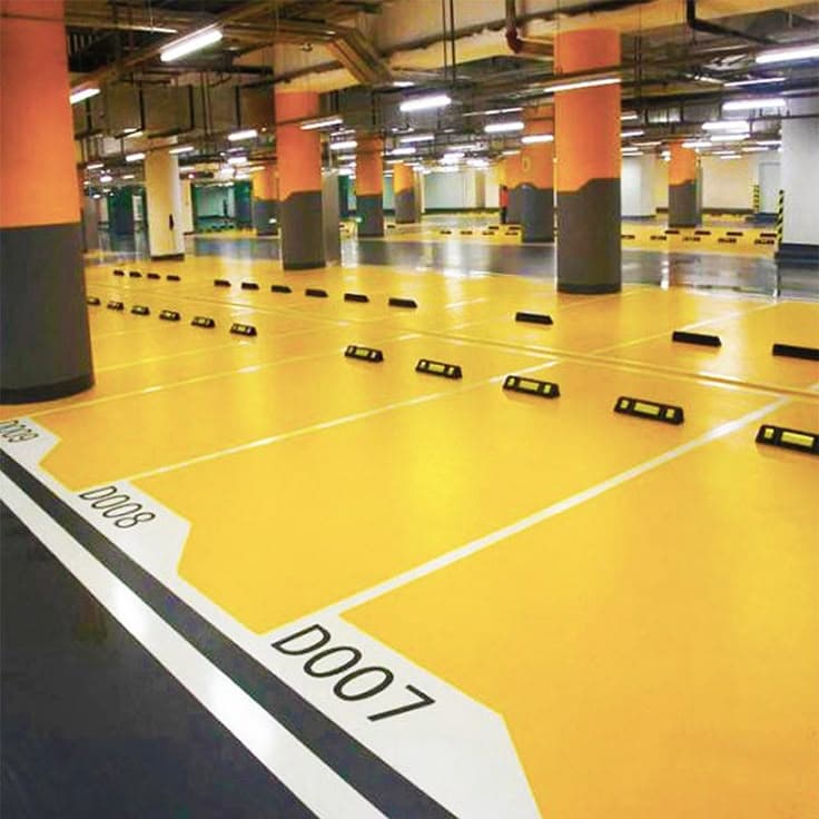 Yellow epoxy parking stalls with white bay identifiers