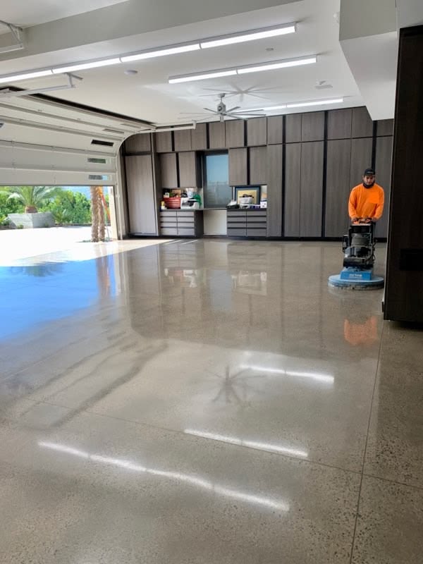 FLOOR POLISHING — polished concrete floor with professional buffer in a modern garage